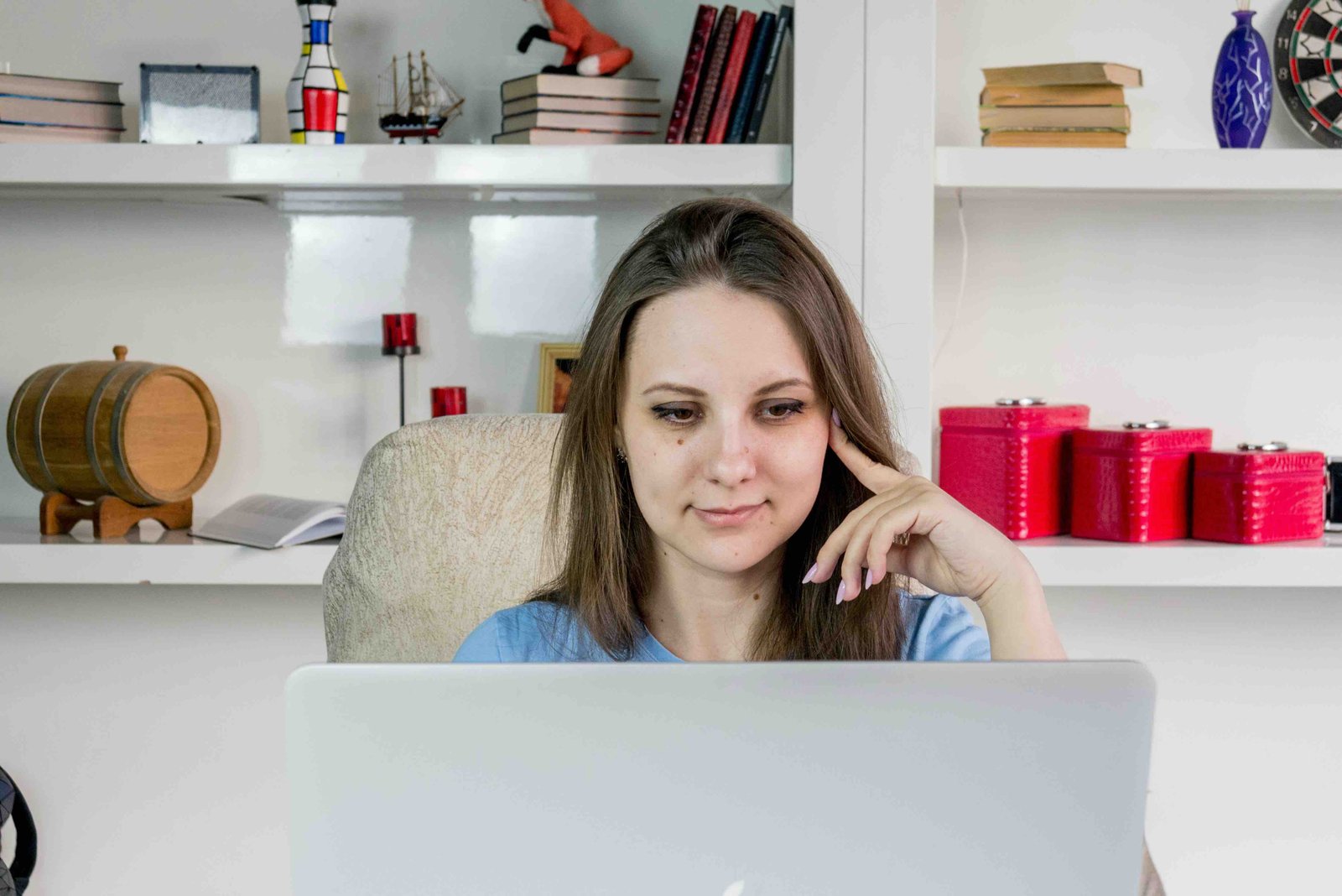 A woman sitting in front of a laptop